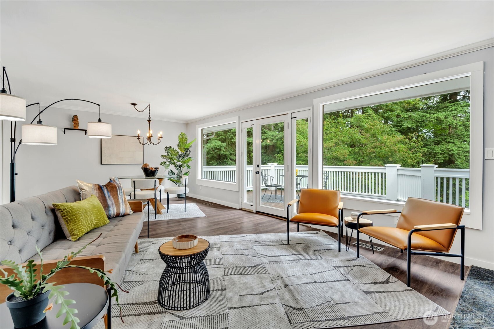 Oversized windows bring in the natural beauty of the backyard.