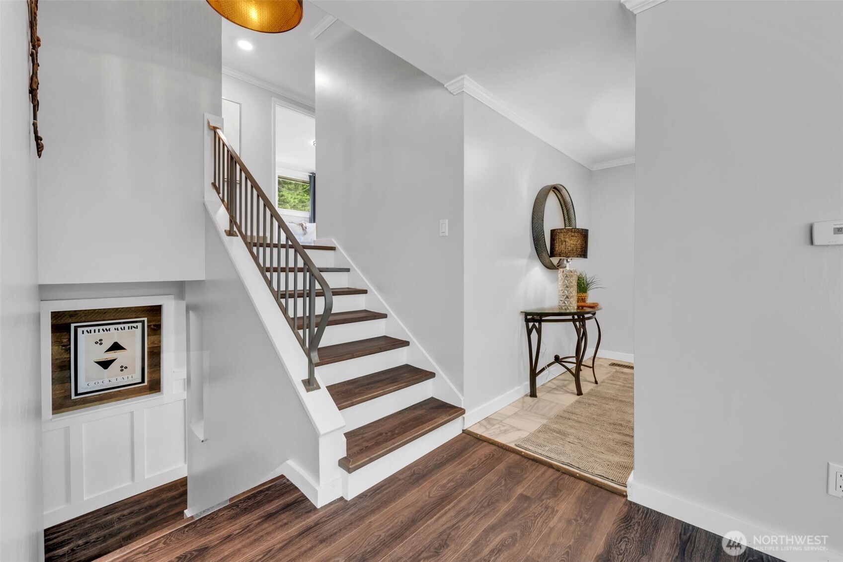 Stairs lead to 3 bedrooms upstairs plus 2 bathrooms.