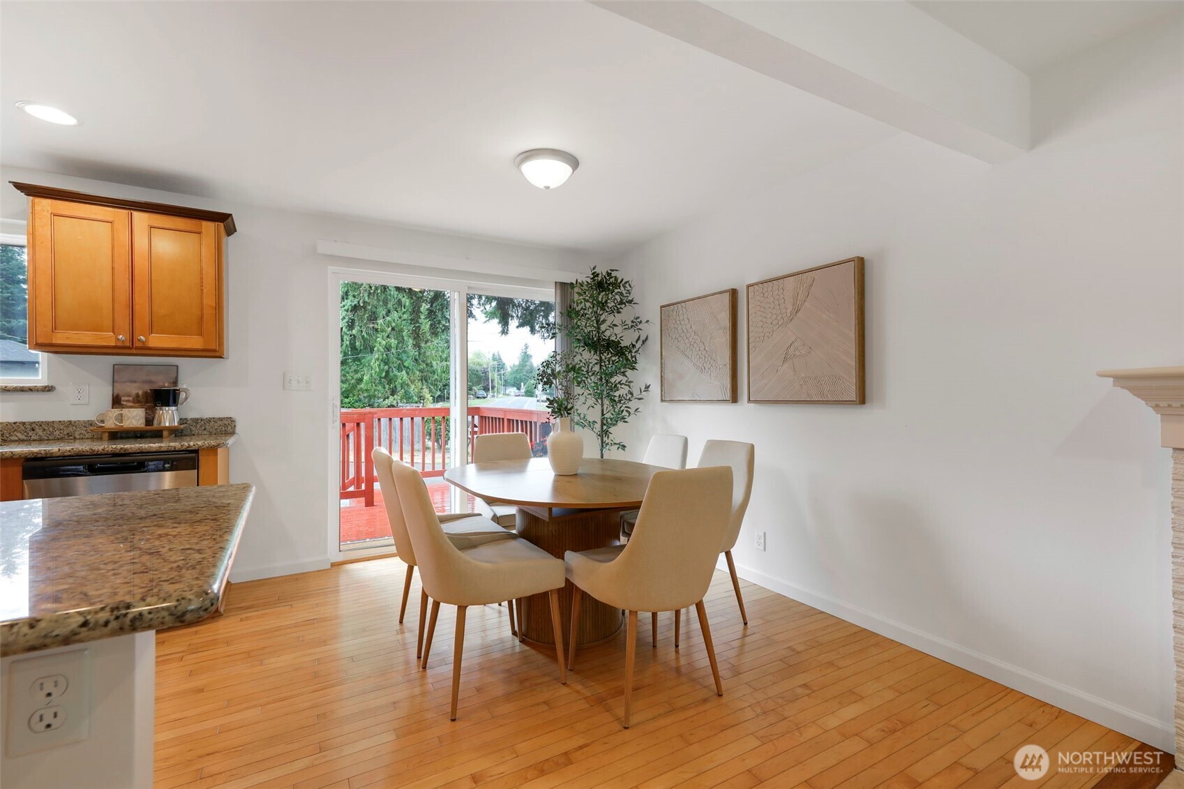 Dining space opens to back deck.
