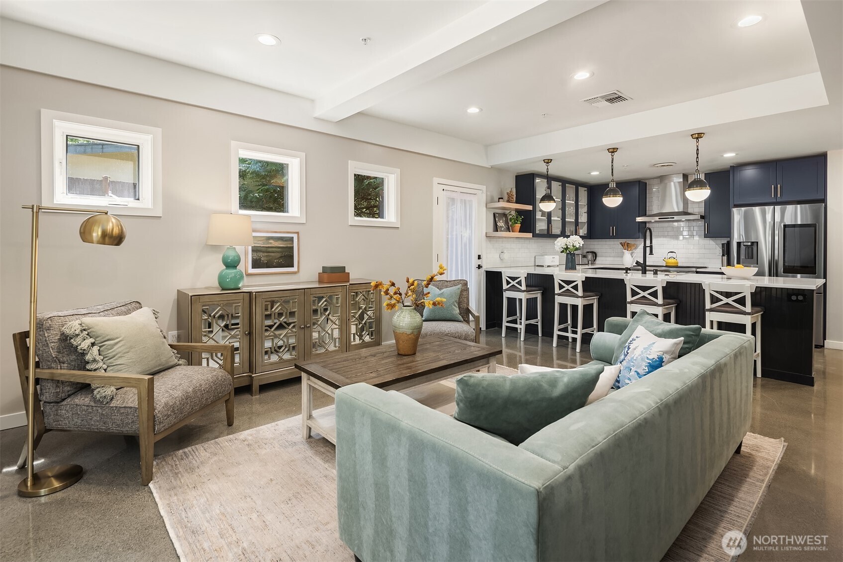 Spacious great room with a connected kitchen, inviting seating area, and stylish finishes throughout.