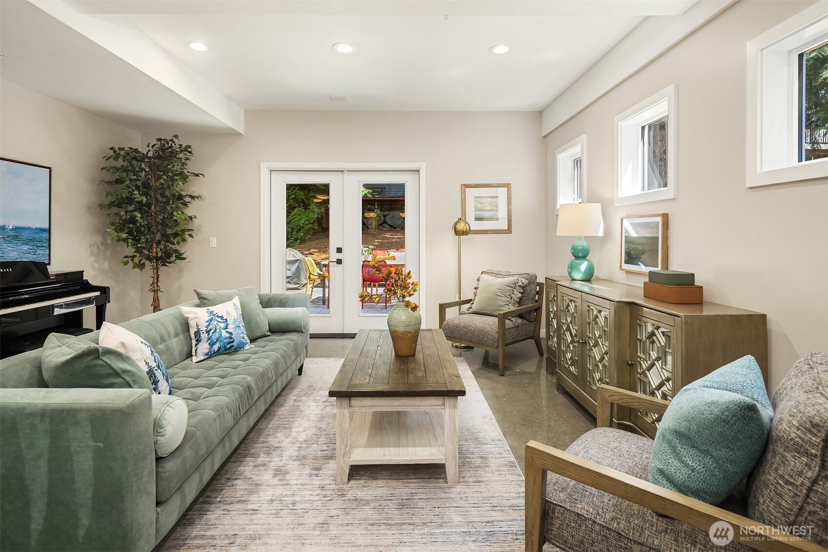 Oversized great room flows effortlessly to the backyard via double French doors—perfect for indoor-outdoor entertaining.