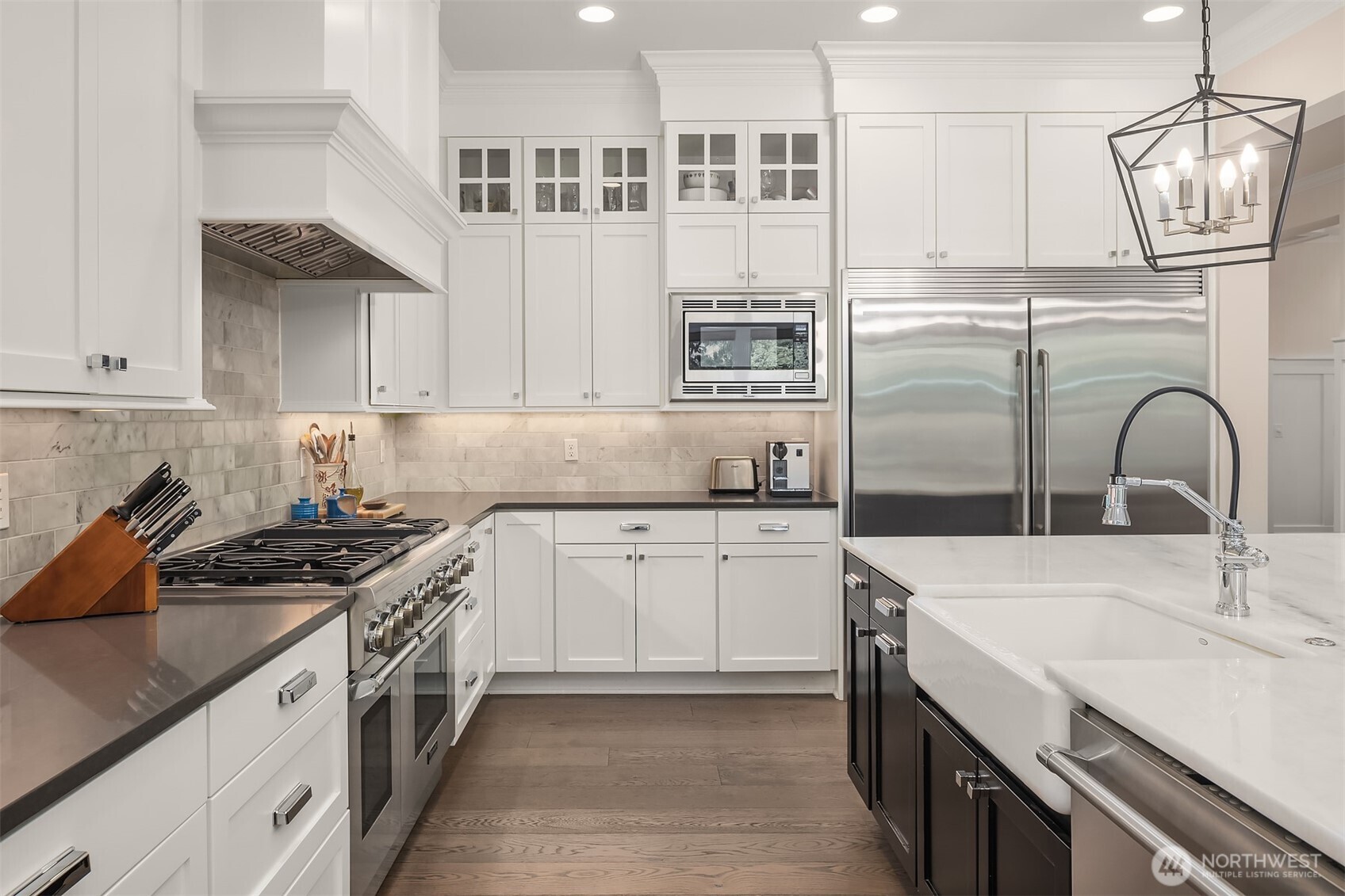 This kitchen doesn’t just bring the heat—it brings the space. With a full-size fridge ready for family feasts and a six-burner range that says, “Go ahead, host Thanksgiving,” this setup was built to handle real life in style.