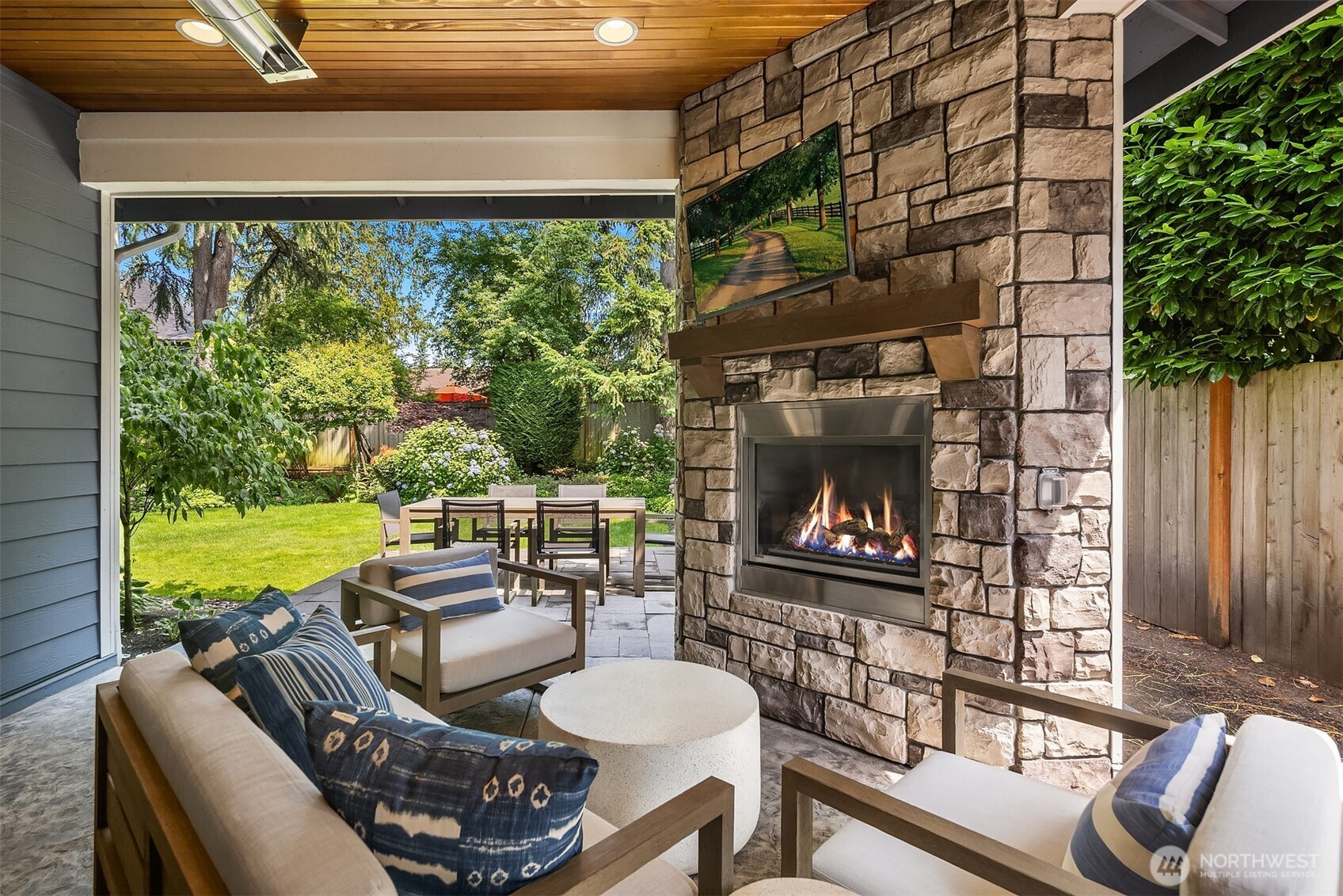 S'mores by firelight, game day on the outdoor TV, and dinner al fresco—this covered patio brings the vacation vibes home, rain or shine.