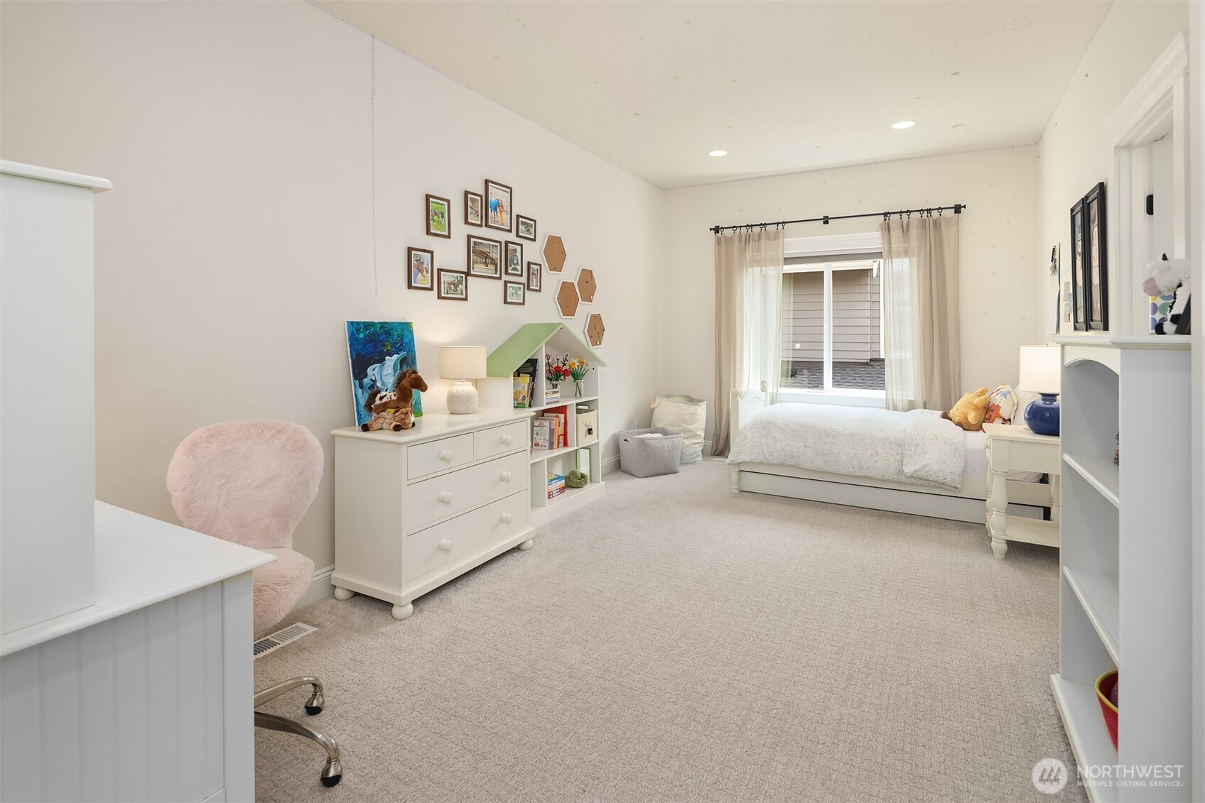 Spacious and light-filled, this upstairs bedroom is perfect for play, rest, or study—with room to grow and space to personalize.