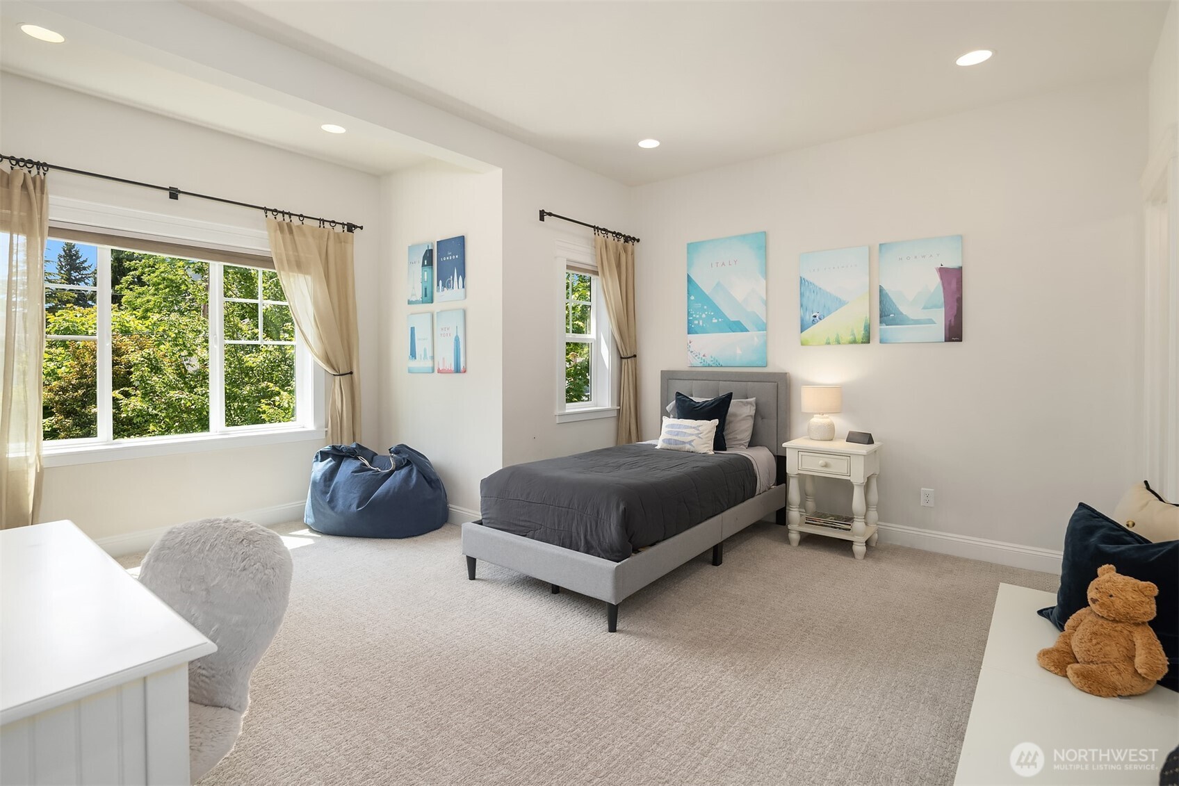 Sun-drenched and serene, this spacious bedroom features its own ensuite bathroom—perfect for guests, teens, or anyone who enjoys a little extra privacy.