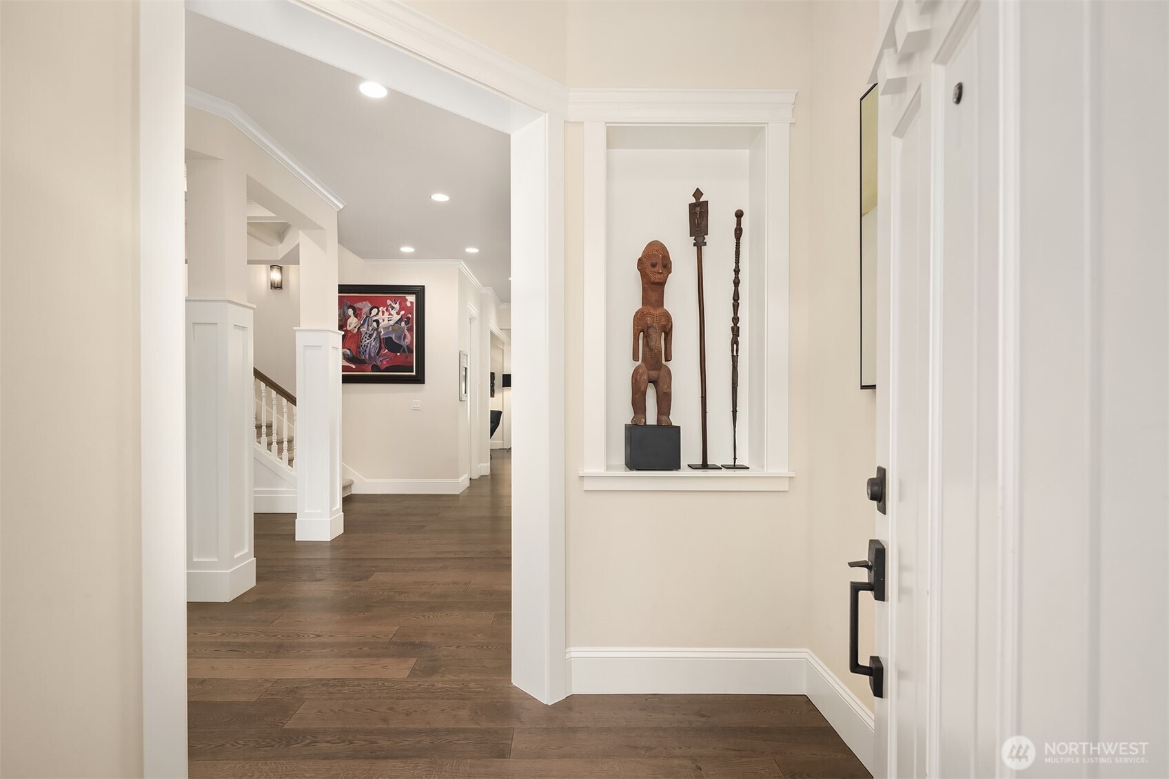 Warm and welcoming entry with rich hardwood floors, elegant millwork, and thoughtful architectural details that set the tone for the rest of the home.