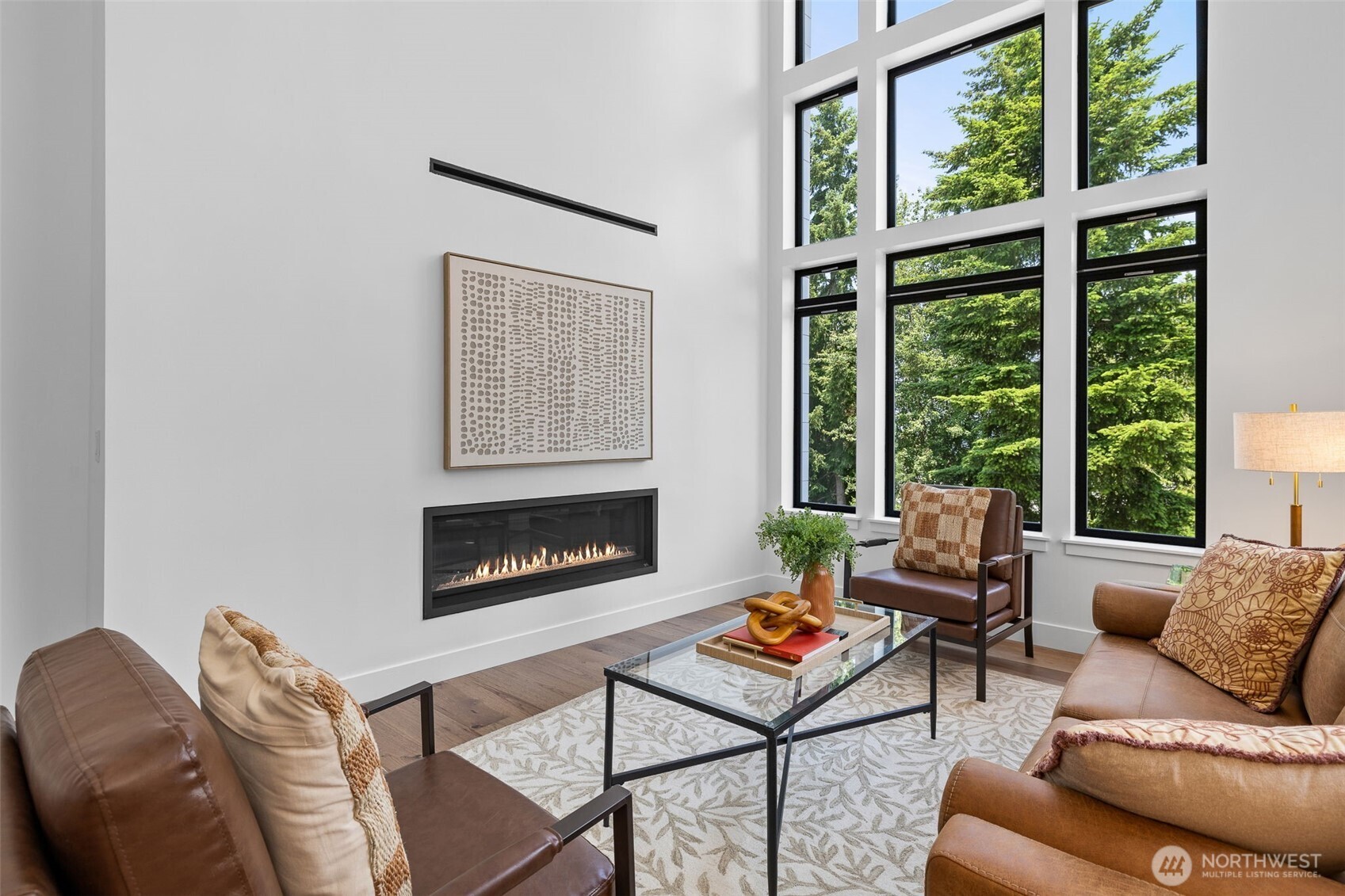 Gas fireplace with ducted heat diffuser allows for lower TV mounting