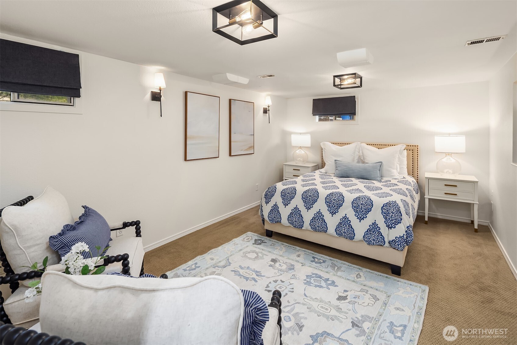 Primary suite is located on the lower level. It includes a three quarter bath and has an office nook.