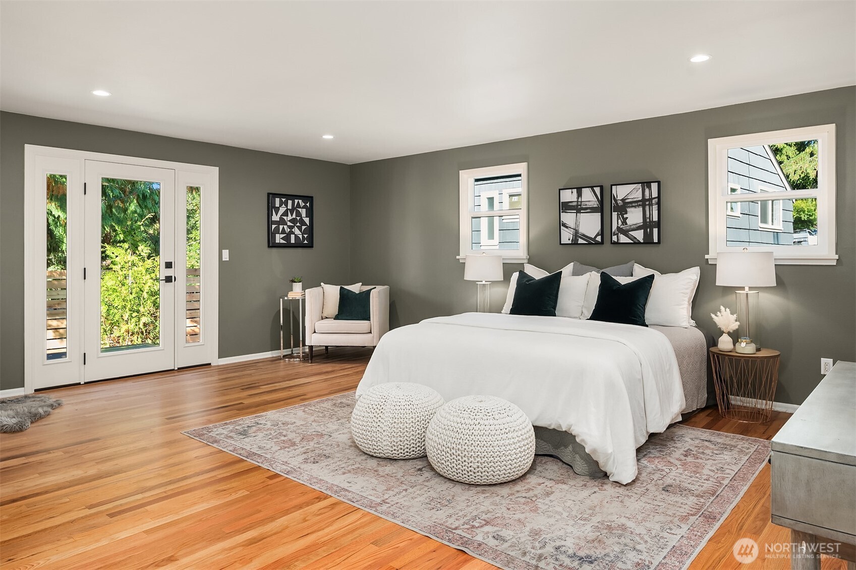 Large and expansive primary bedroom has room for everything. King sized bed, reading area, work out space? Picture is from previous listing.