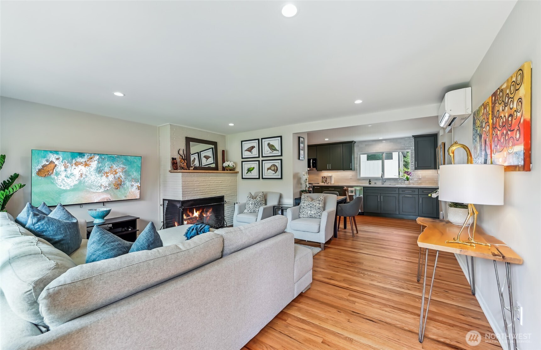 Step inside to your warm and inviting living room with real wood fireplace. Hardwoods throughout home.