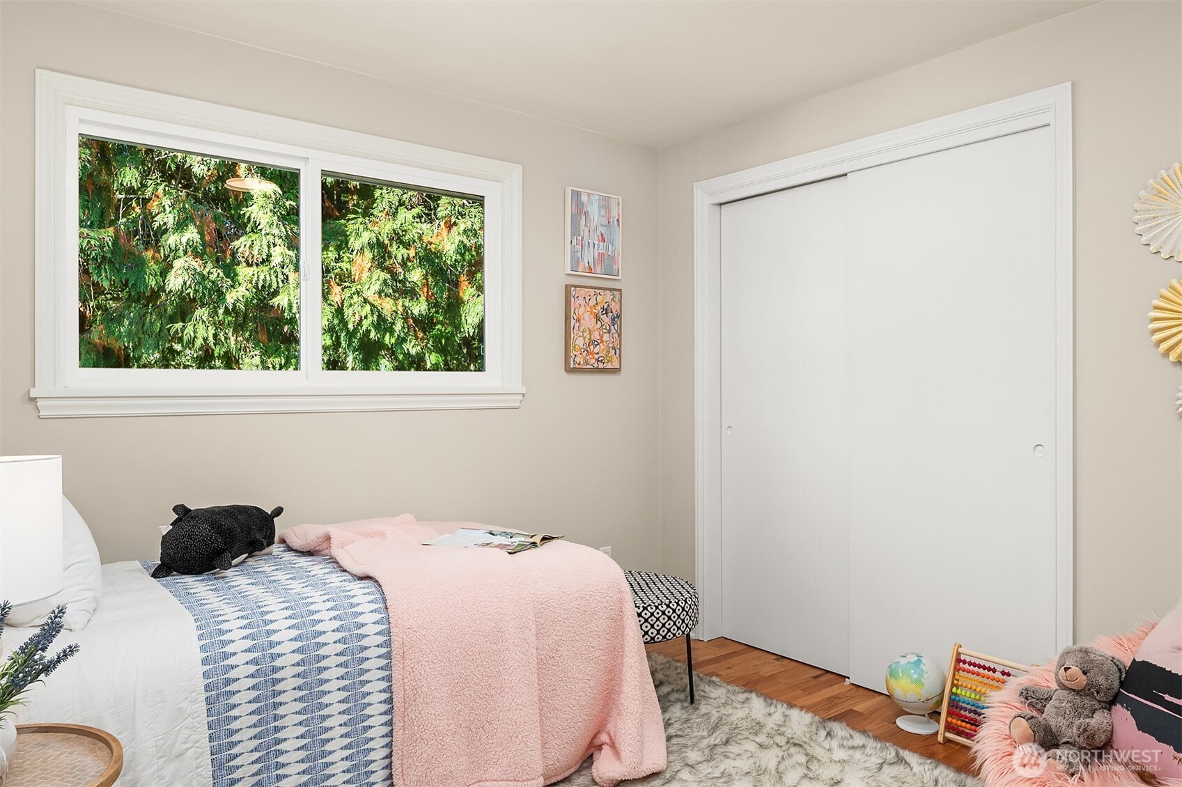 Third bedroom looks out onto the private backyard. It is currently being used as an office. This picture is from a previous listing.