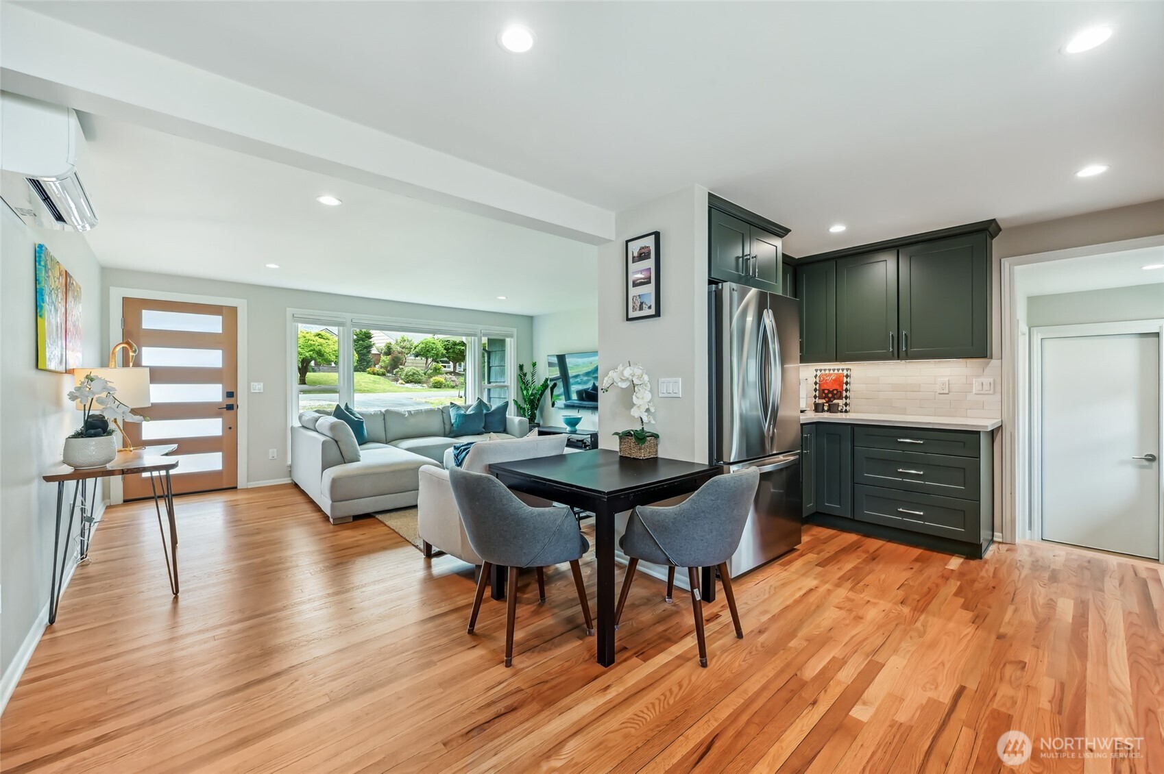 Dining space is perfectly situated next to large and open kitchen.