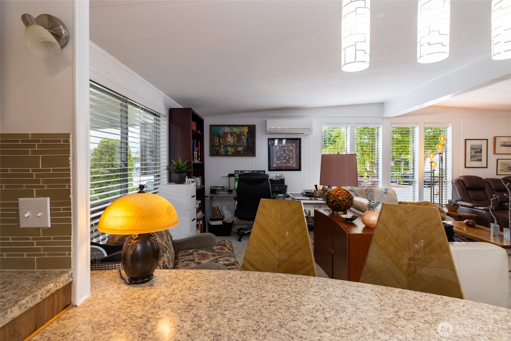 Looking from the eat-in kitchen space to the large additional living room.