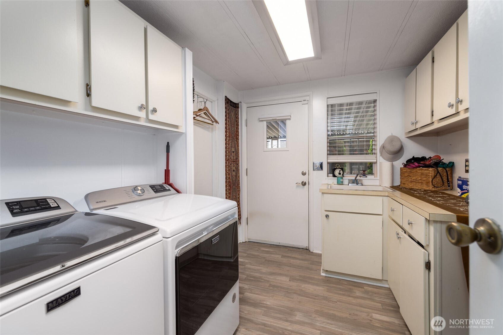 Spacious laundry room with storage and counter space. Washer and dryer new in 2020.