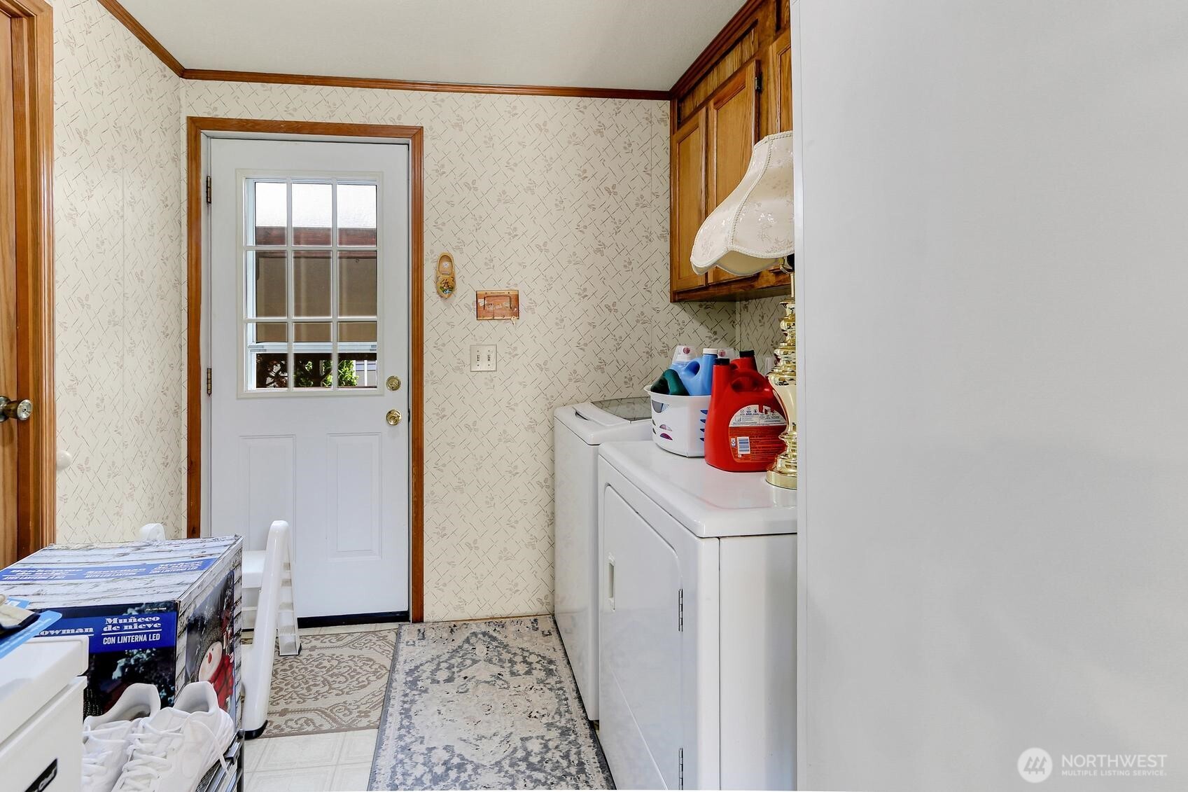 Laundry Room that leads to the Covered Carport.  Washer & Dryer Included!