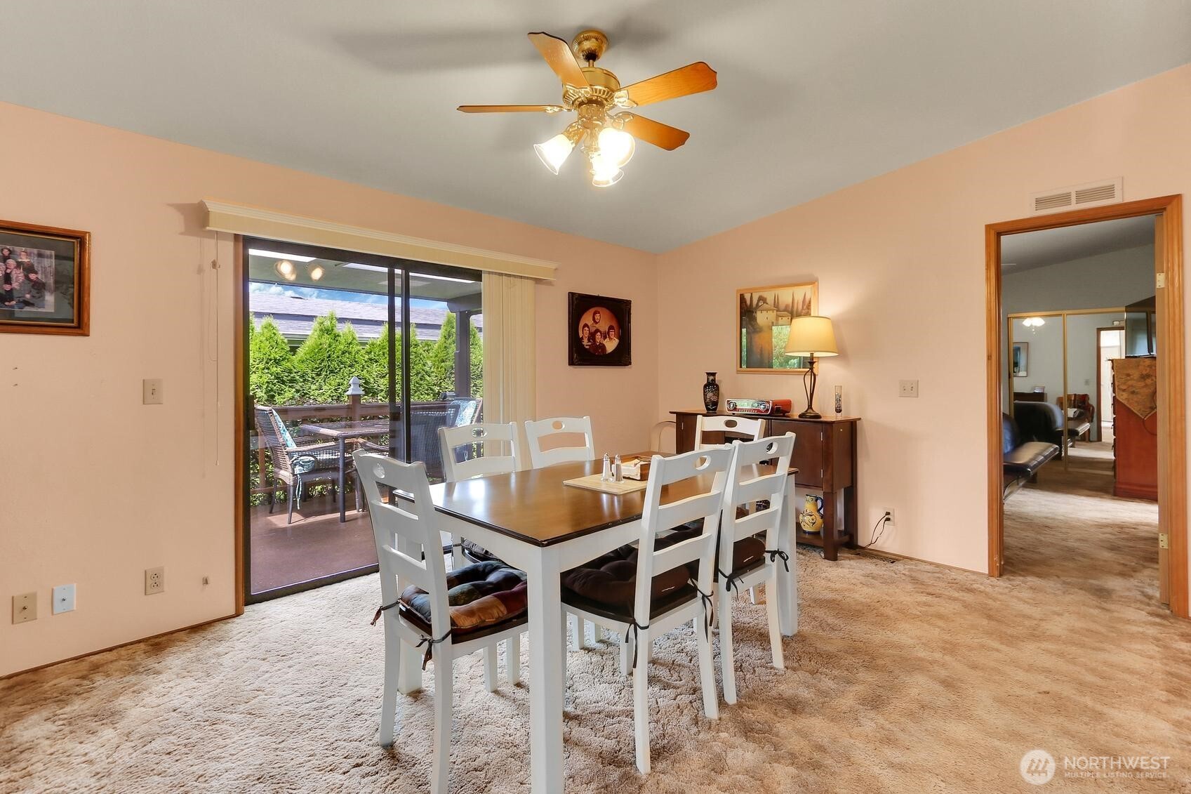 Slider from the Family Room/Dining Room with a Slider that leads to the Private Covered Deck with Room to BBQ & Relax!