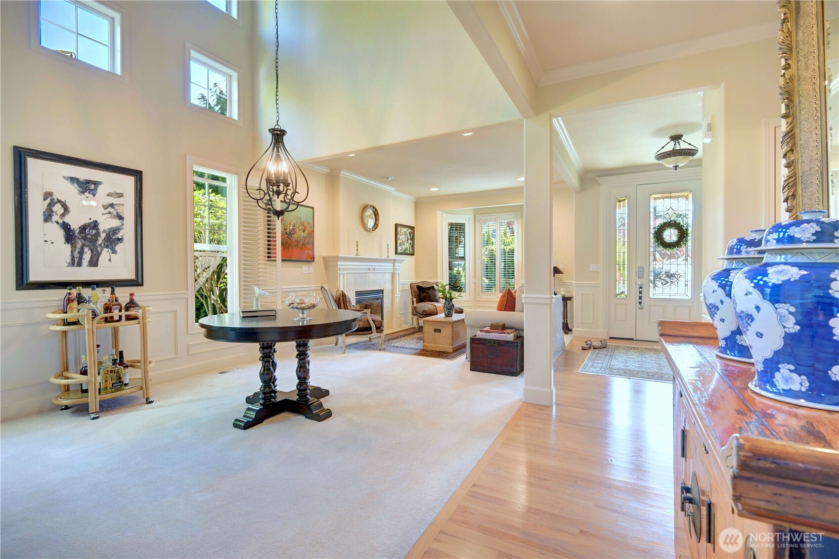 Living room with bay window and gas fireplace.