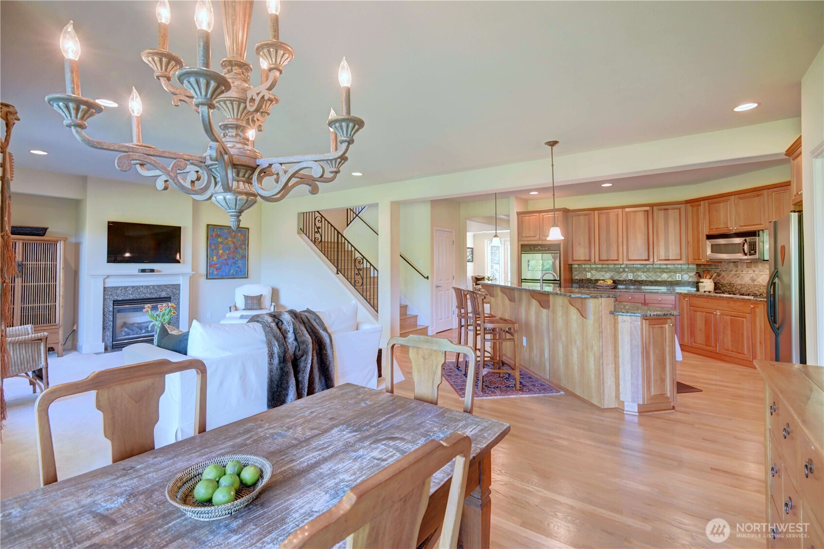 Formal dining room with soaring ceiling and new lighting fixture.