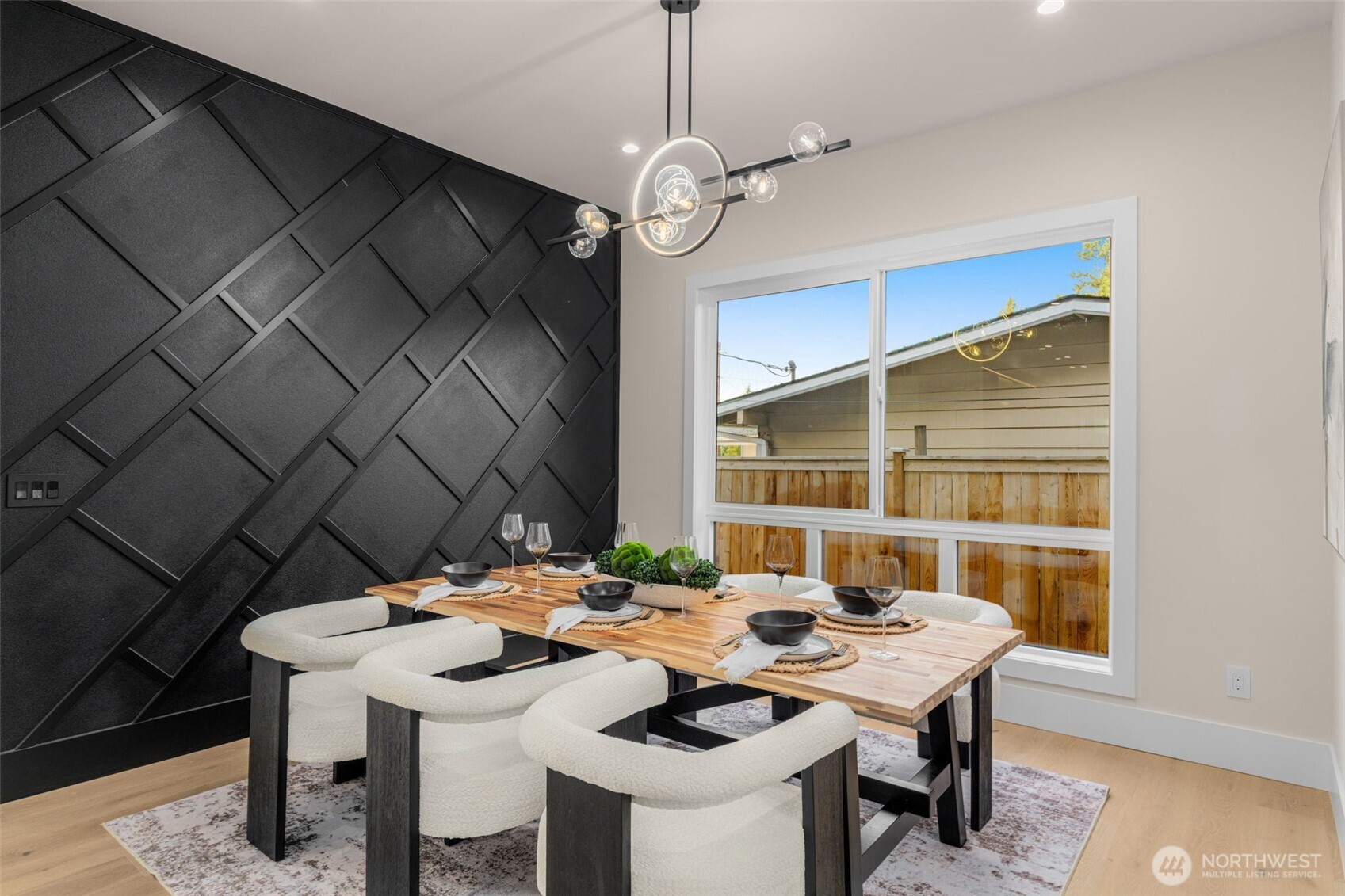 Large dining room with accent wall