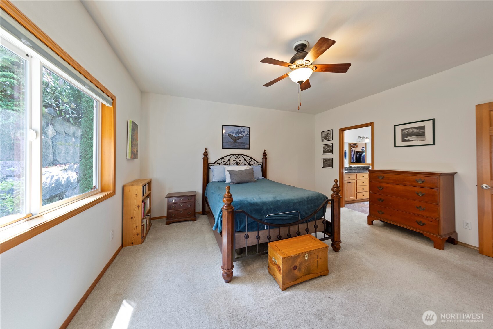 Primary bedroom with ensuite and large walk-in closet.