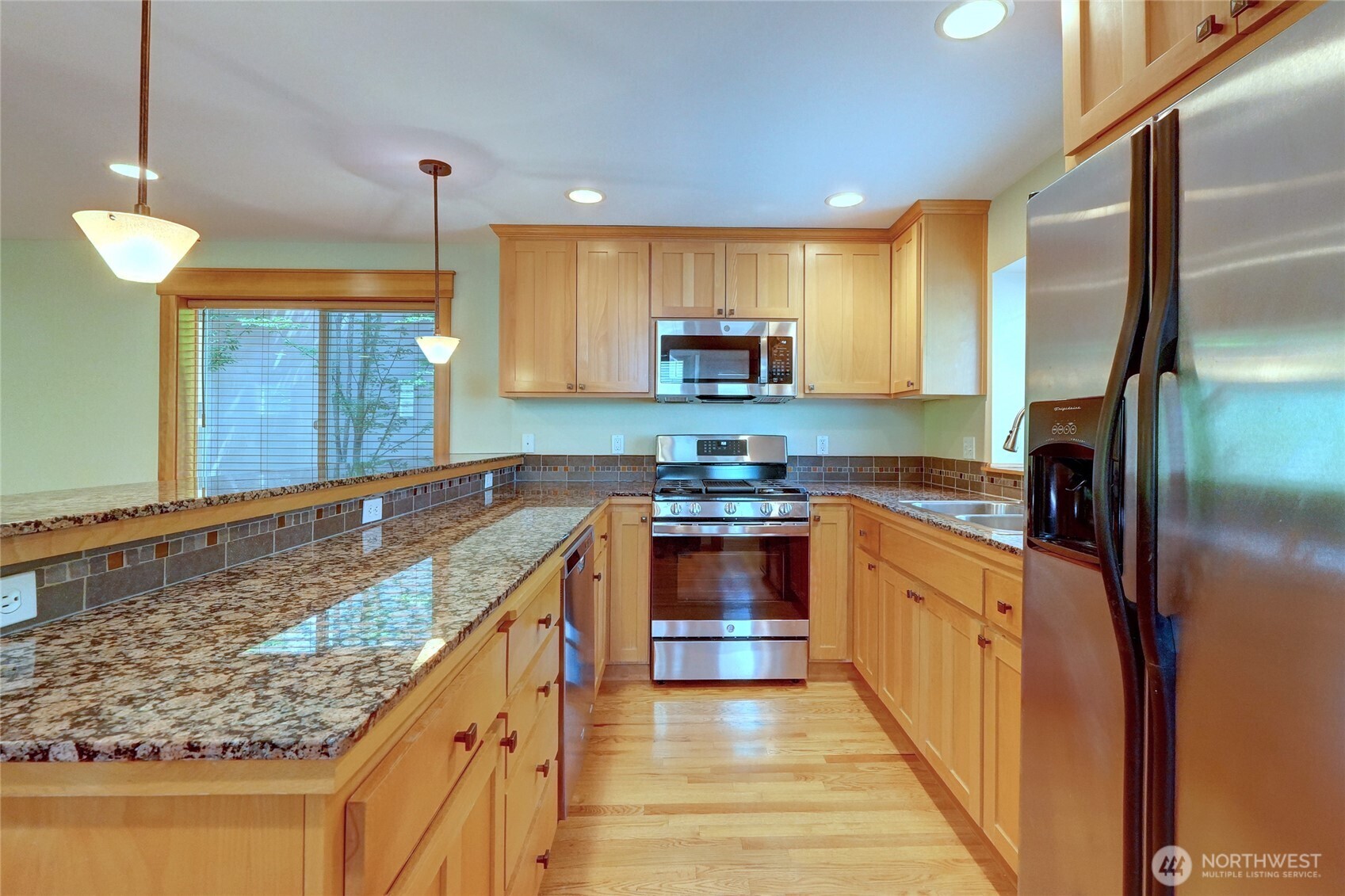 Kitchen with Granite Counters & SS Appliances