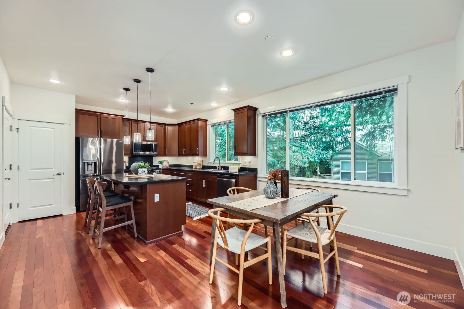Spacious kitchen with all new matching LG appliances, pantry, deep sink, hardwood floors and breakfast bar.