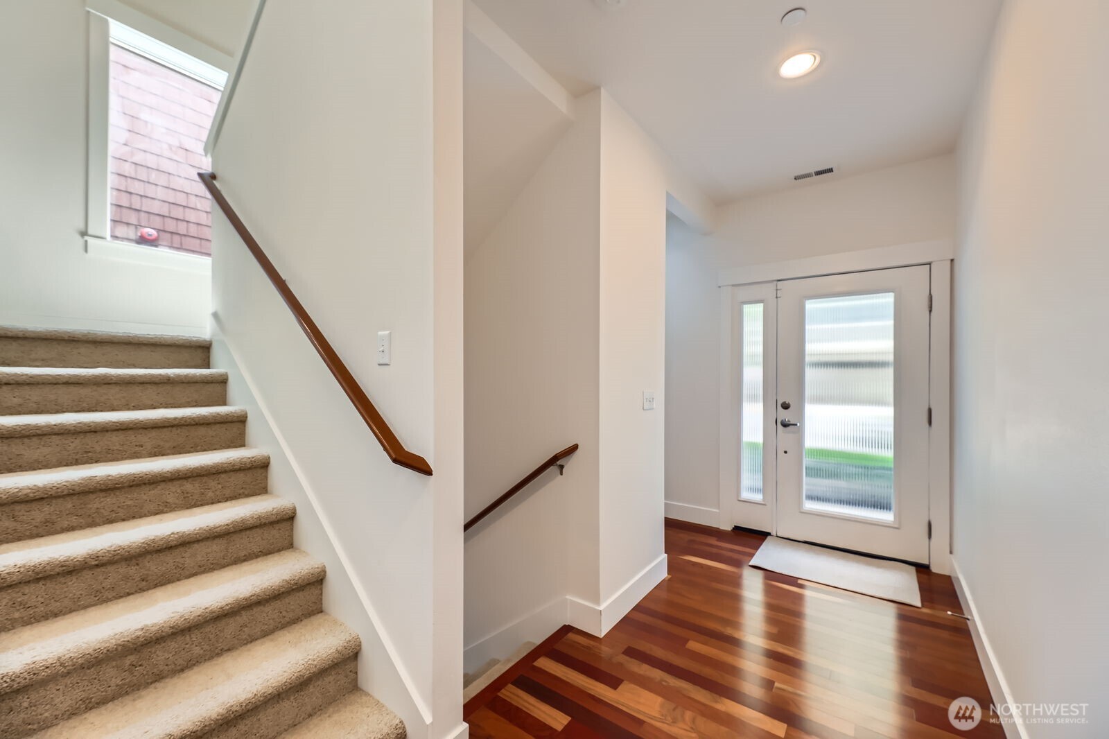 Light and bright entryway with Brazilian cherry hardwood floors, HD lighting and 10 foot ceilings.