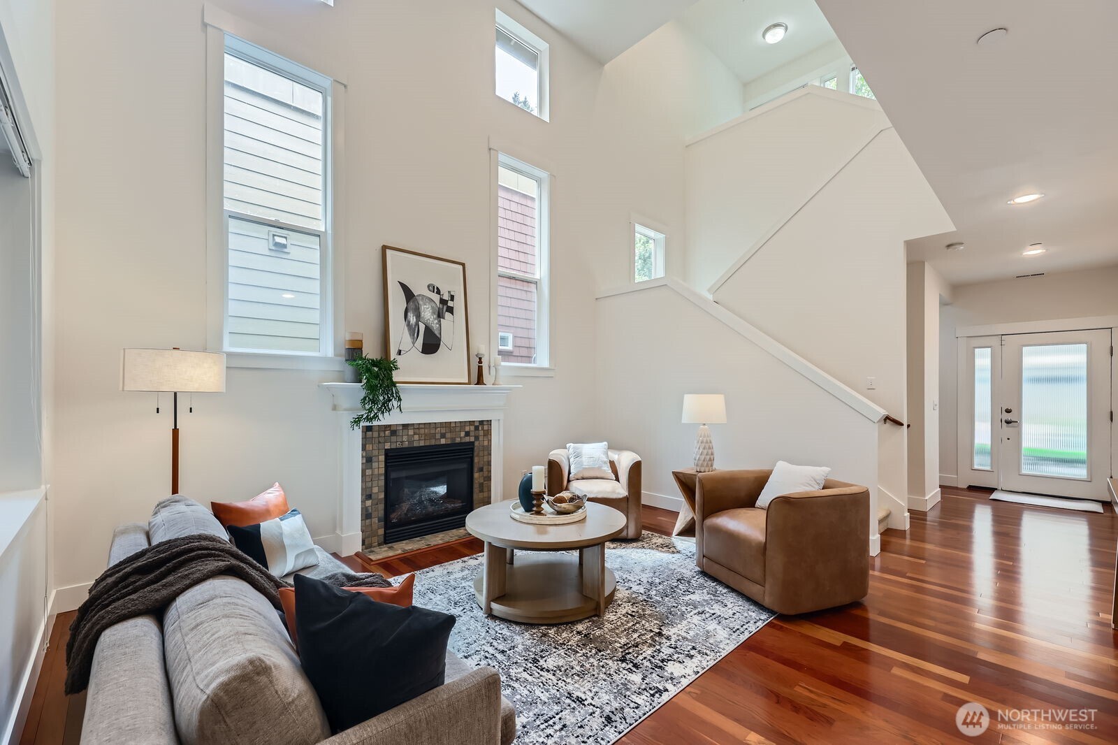 Architecurally interesting! 30ft ceilings, multi-story windows, loft/reading nook and gas fireplace.