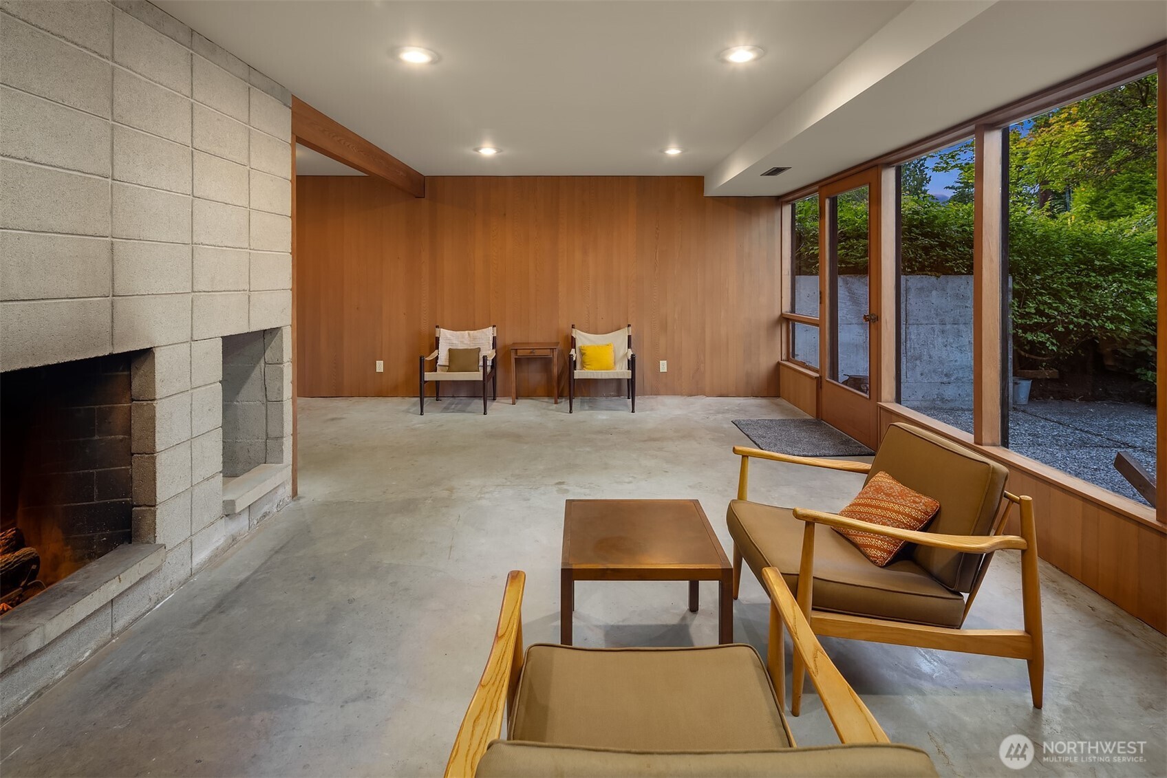 Lower level has a second wood fireplace