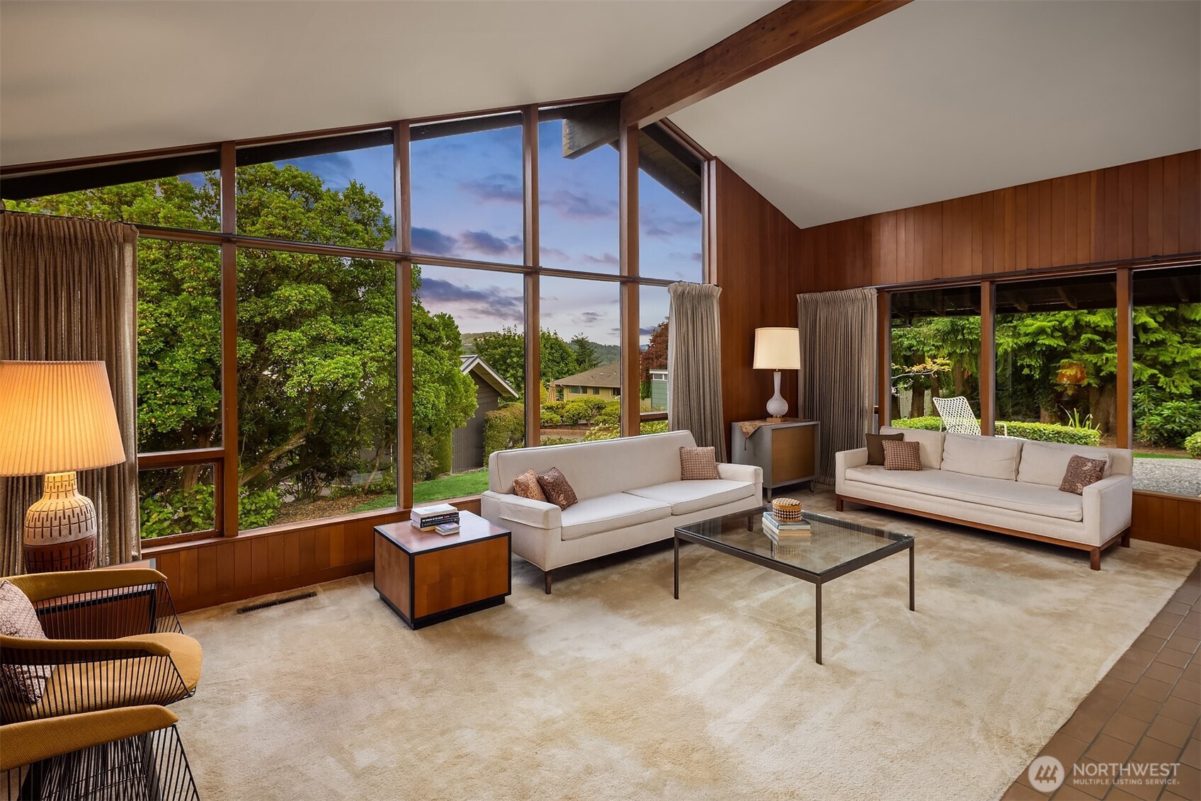 Soaring ceilings bring lush greenery into the home.