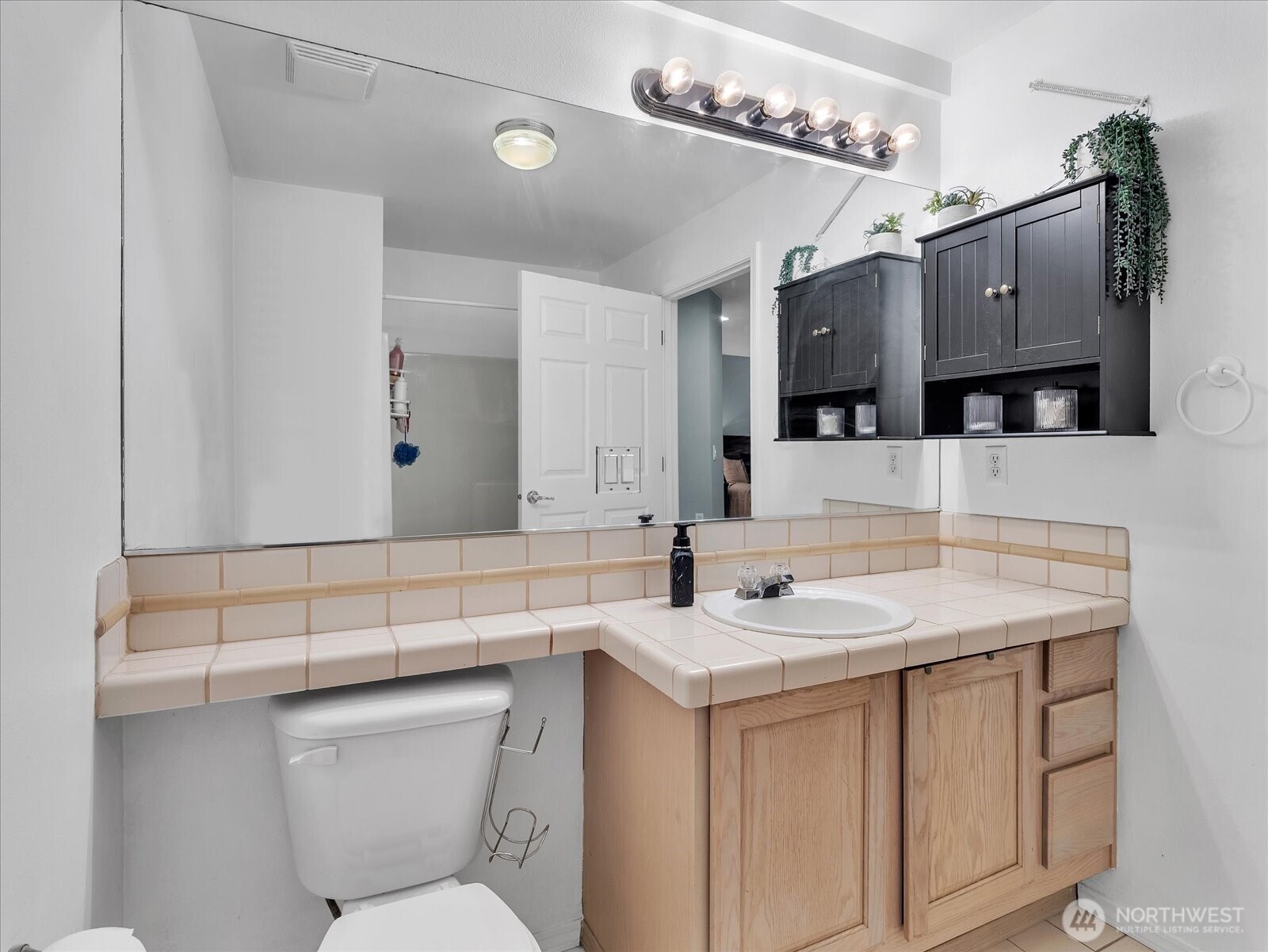 Primary bathroom with tub and shower combo off of primary bedroom.