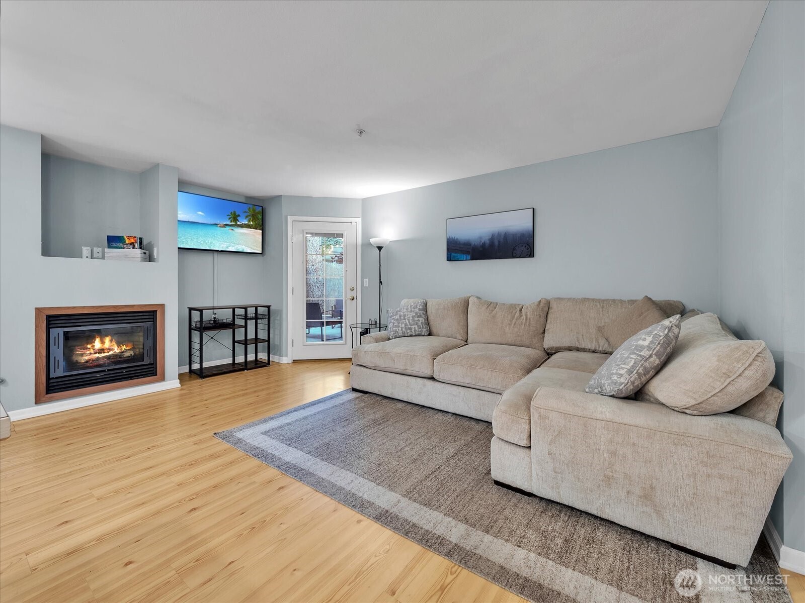 Open floorplan with cozy fireplace.
