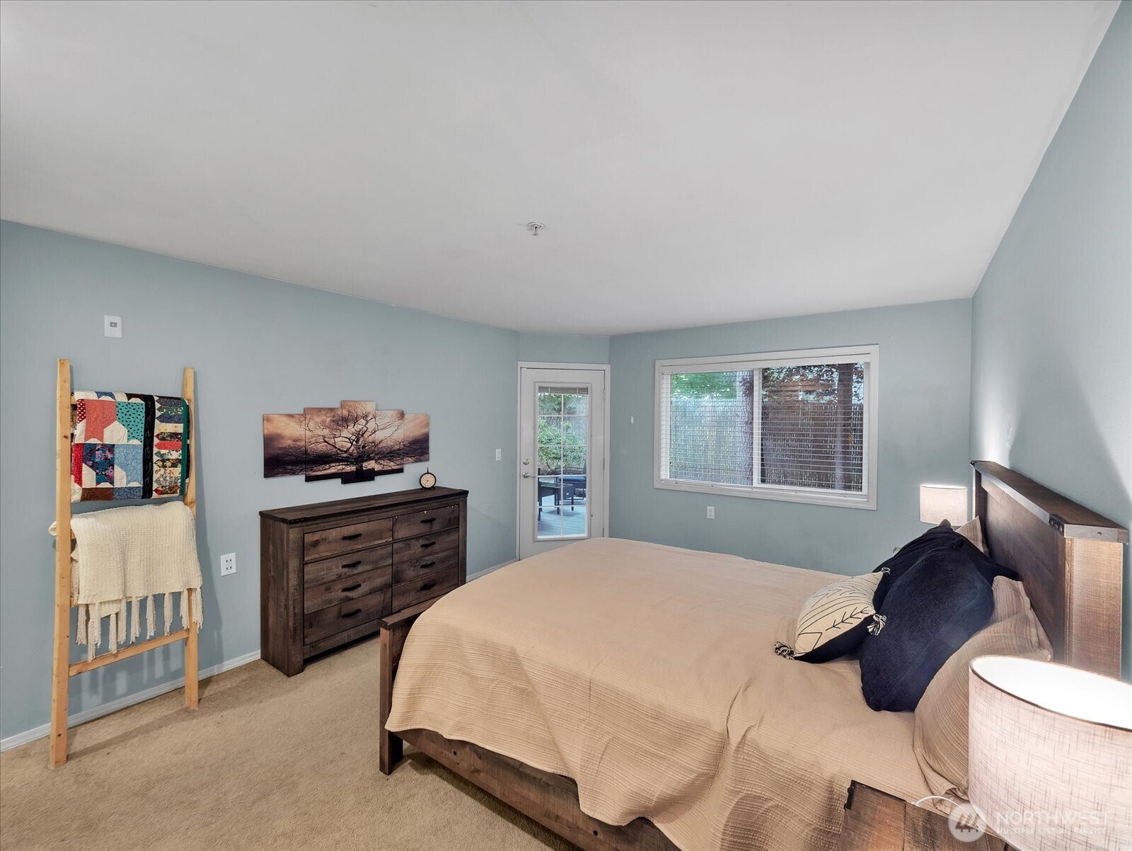 Large primary bedroom with access to deck.