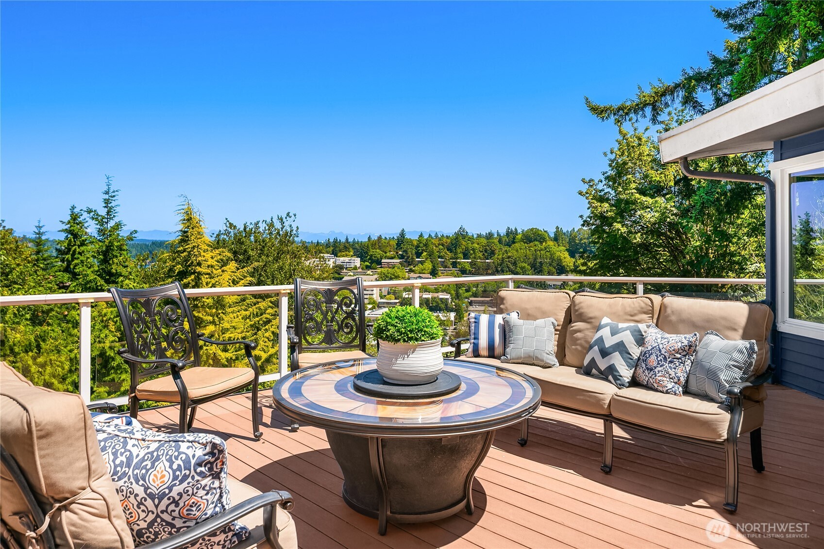 Welcome to your entertainer's deck with expansive views of the Cascades, Lake Washington and downtown Mercer Island.