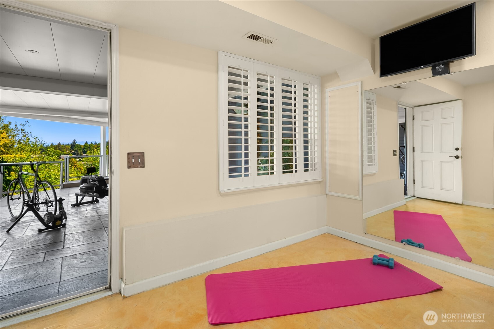 Get your workout on in this space leading to the lower deck. Deck is plumbed for a hot tub and has built-in heaters.