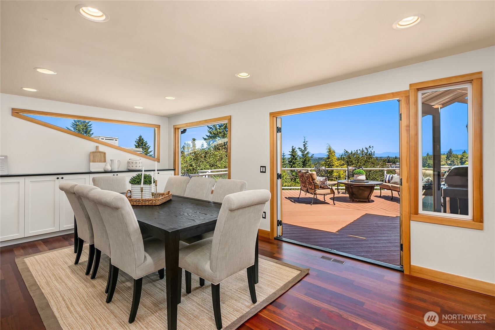 From the moment you walk into this home you see the east-facing expansive views from all directions. This generously sized dining room features a built-in buffet and storage along the north wall.