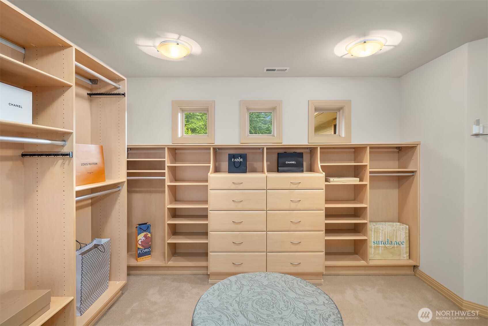Dreamy custom walk-in closet just off primary bath