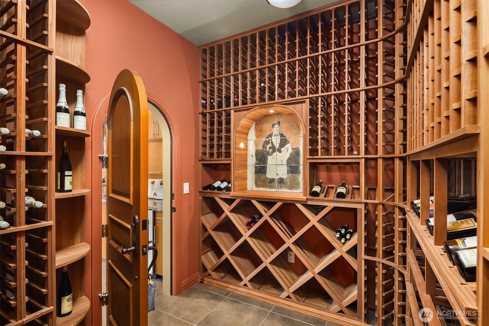 200+bottle wine cellar; thru here there is access to huge, carpeted storage room