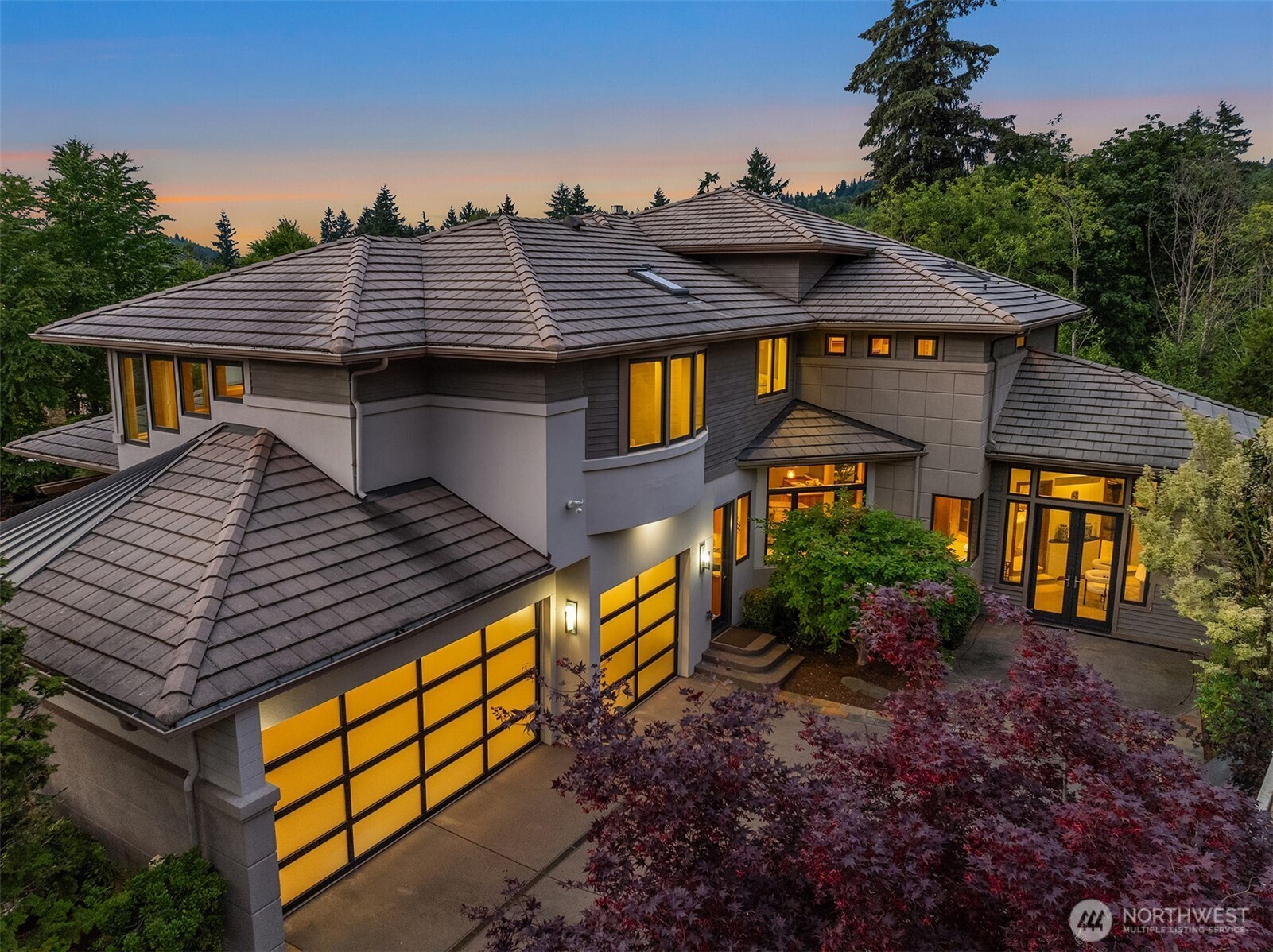 Three car garage with extensive built-ins and modern translucent garage doors. Wired for generator and EV charging too!