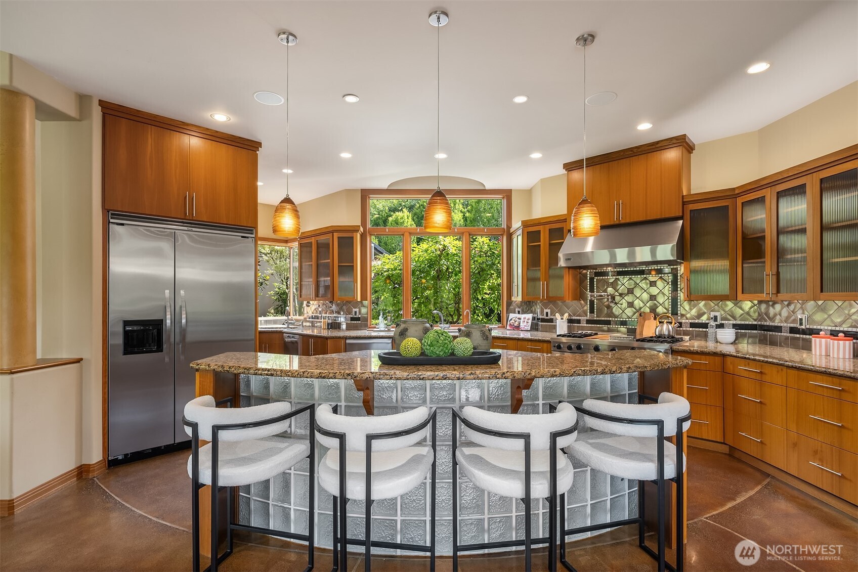Gourmet kitchen features Viking professional appliances, including 48inch built-in refrigeration, double-oven range with gas cooktop, griddle and chargrill, separate electric wall oven, two dishwashers, built-in microwave and warming drawer