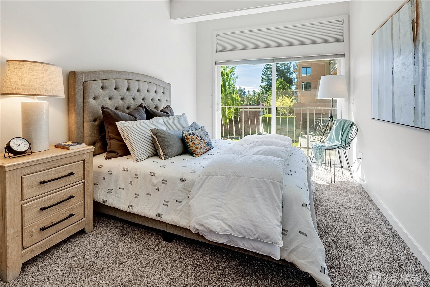 The delightful bedroom features a large walk-in closet and large sliding glass door that opens to a charming private balcony.