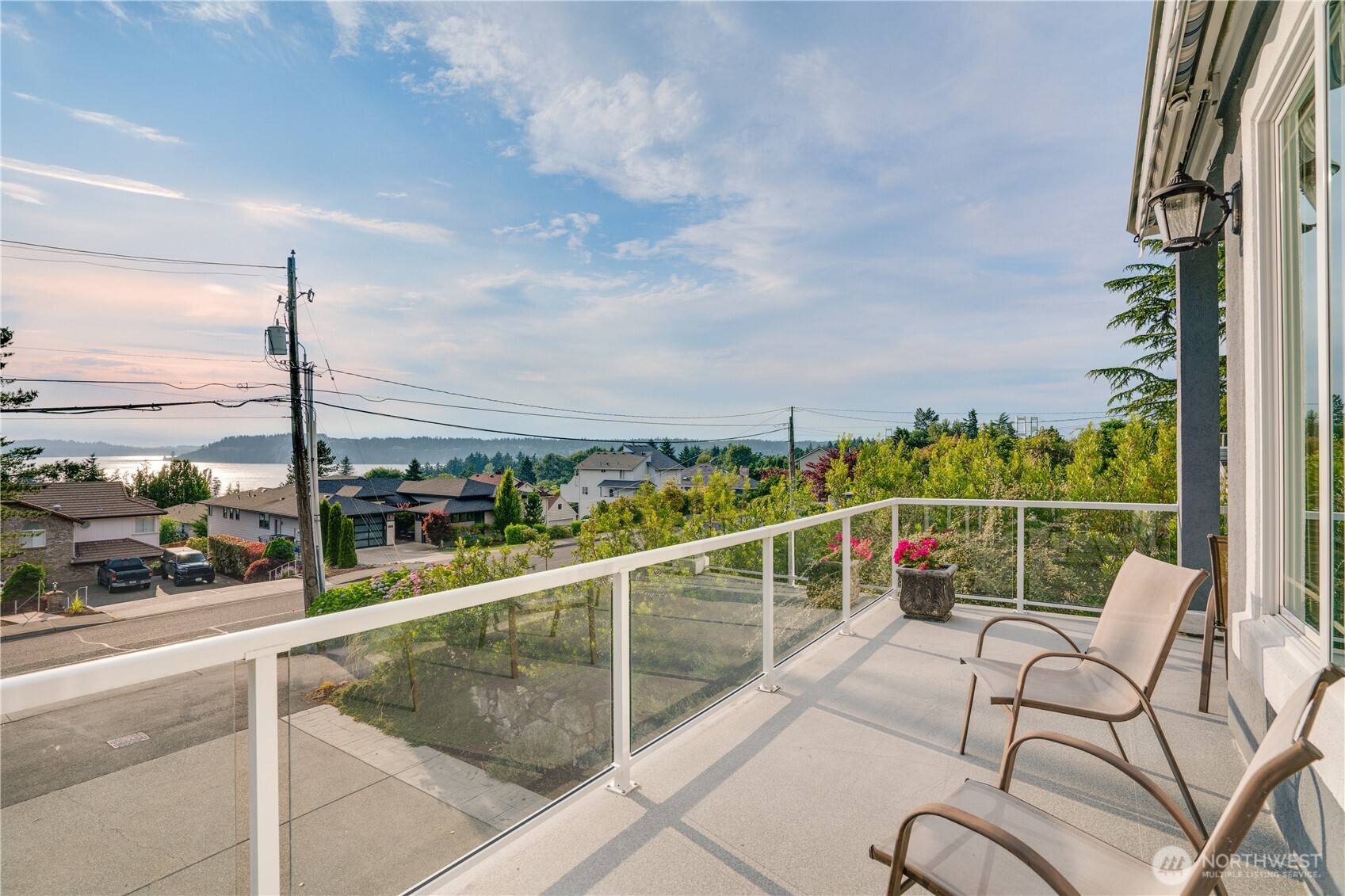 View deck off the great room wraps around the home with a portion that is covered.