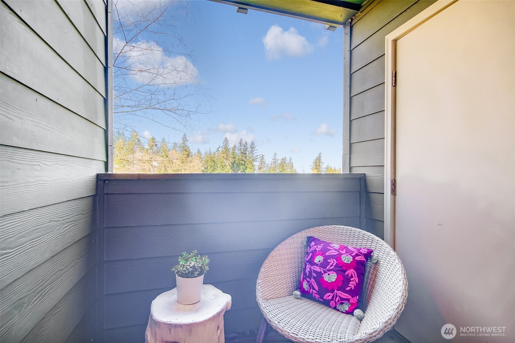 The balcony looks out to the lake, mountains, trail and has storage