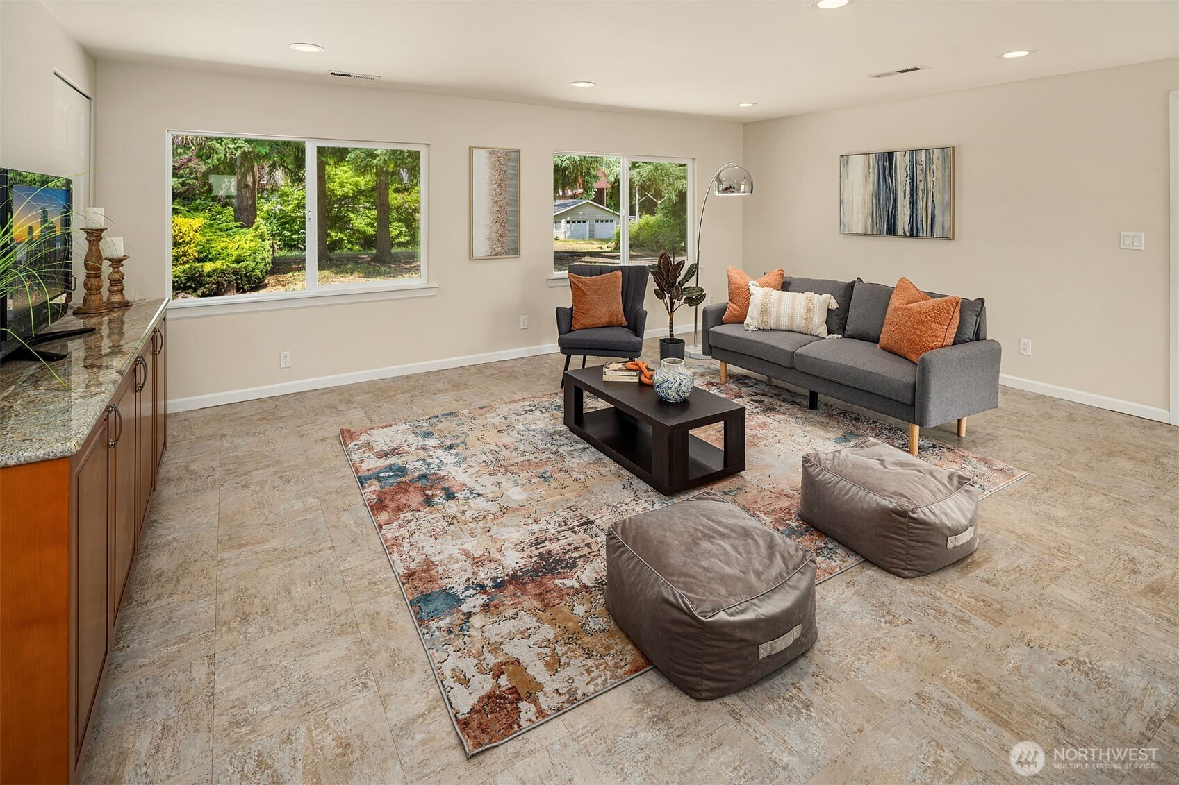 Large family room that is sectioned off by french doors.