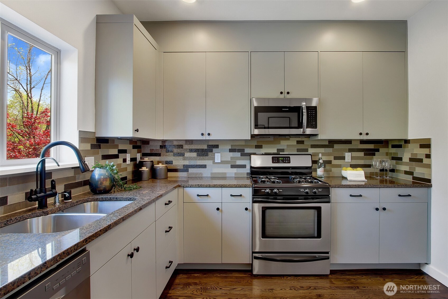 Tons of great storage space here for Costco-sized purchases. Watch the leaves change through the seasons on your maple tree as the sink overlooks your patio.