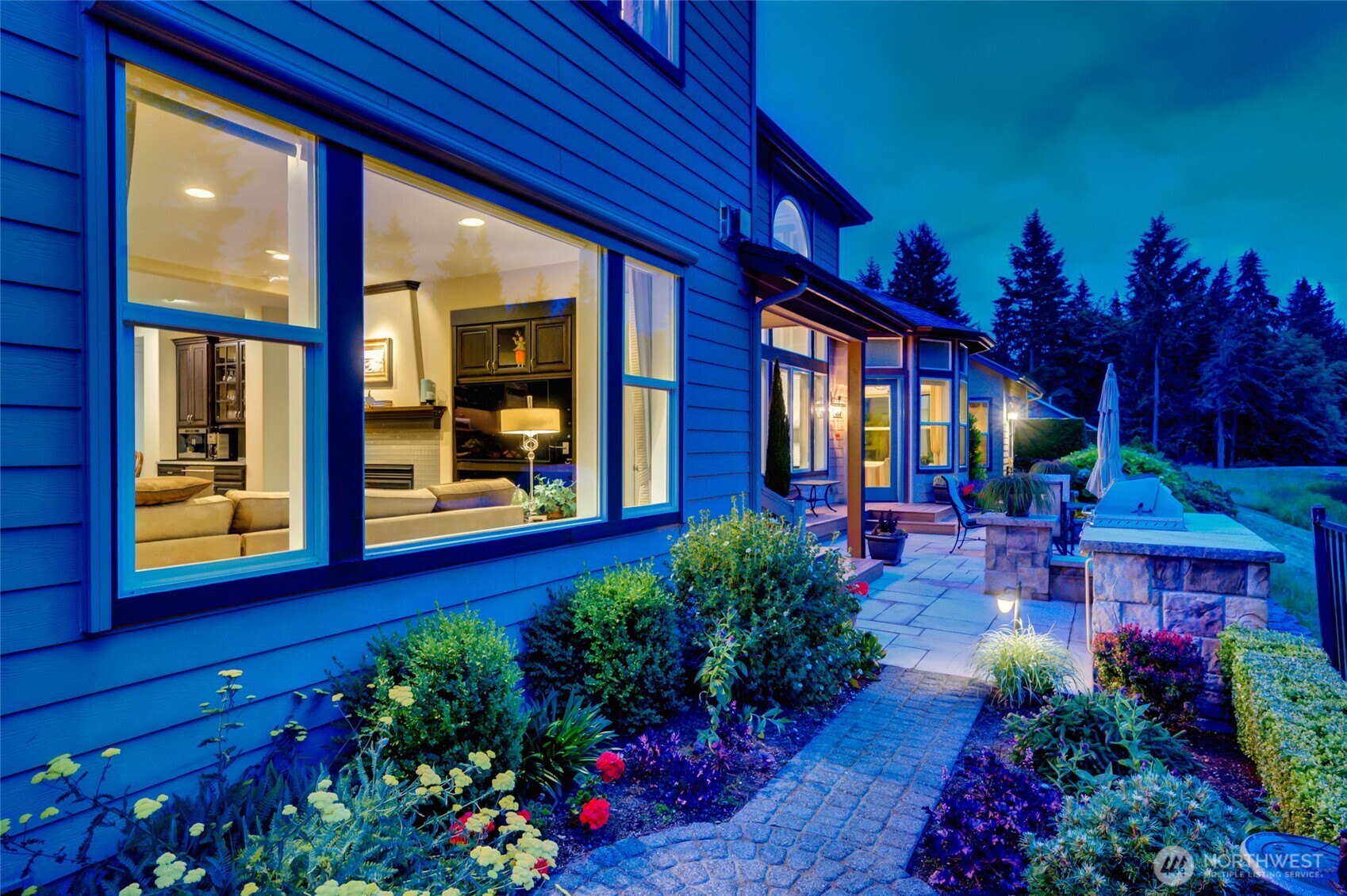 The gardens around the home were designed so that there is always color somewhere in the yard.