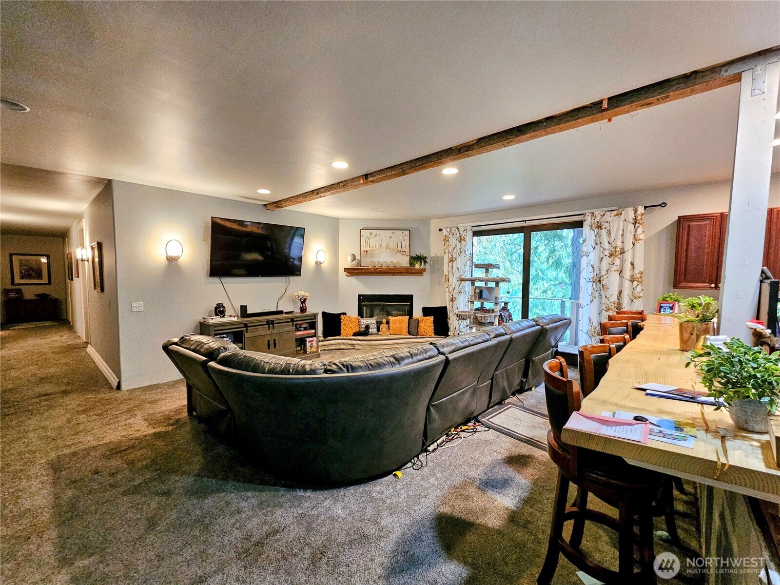 View of second floor living room and kitchen