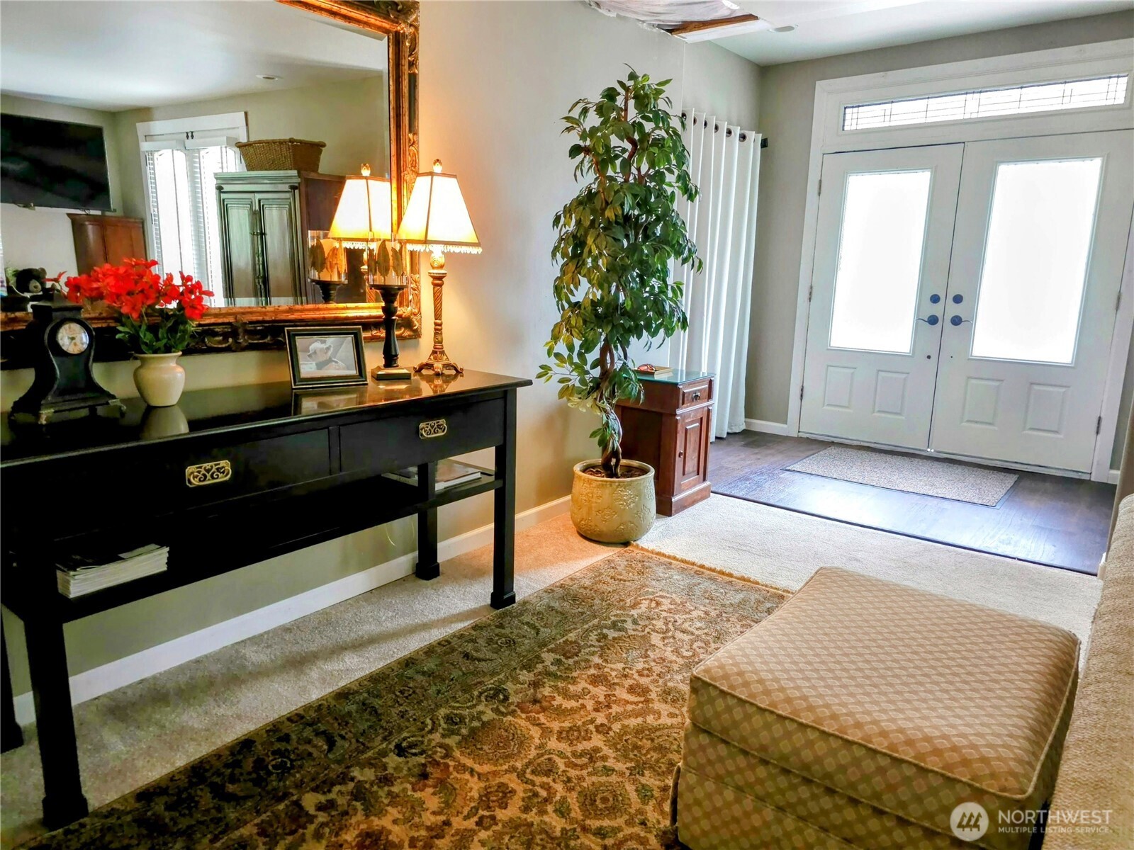 Expansive living room on the main level, offering an inviting space for relaxation and entertaining.