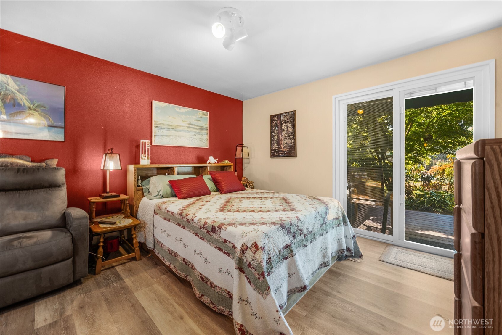 Large pimary bedroom on main floor with slider to direct access to back yard and hot tub