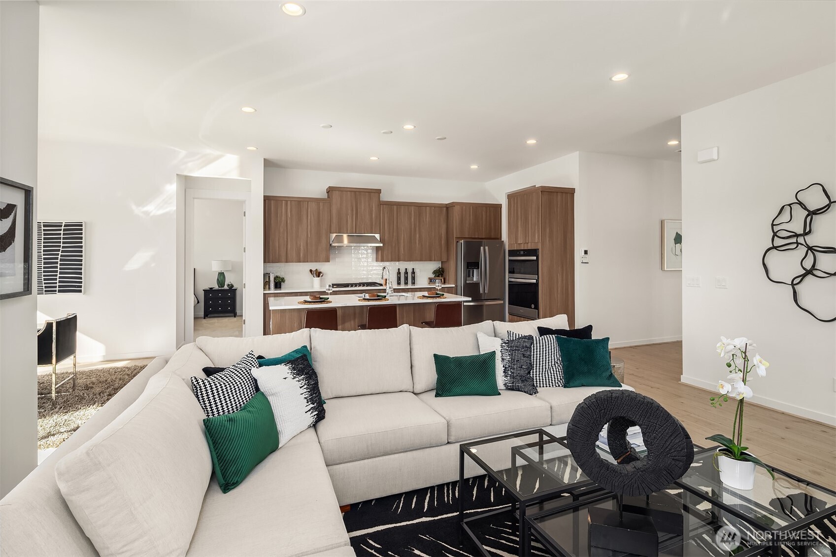 Great Room open to modern kitchen Photos for illustrative purposes